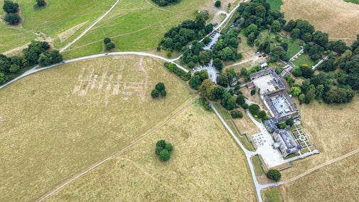 Aerial image show parch marks at Dinefwr revealing the remains of former Nissen huts